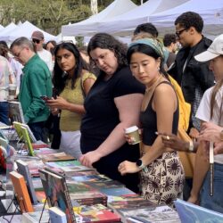 Serious readers take in serious books at this table during Sunday’s Brooklyn Book Festival. Photo: Mary Frost, Brooklyn Eagle