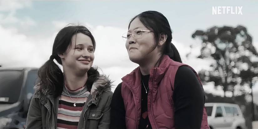 Mia and Gabby sit with each other outside in The Survivors